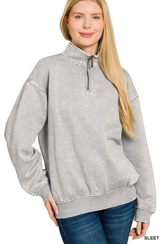 Woman in a soft grey (sleet) acid wash fleece pullover with a zip collar and cozy texture.