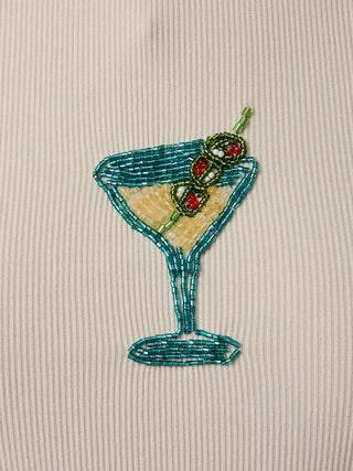 Close-up of beaded martini glass embellishment with blue, green, and gold beads. 