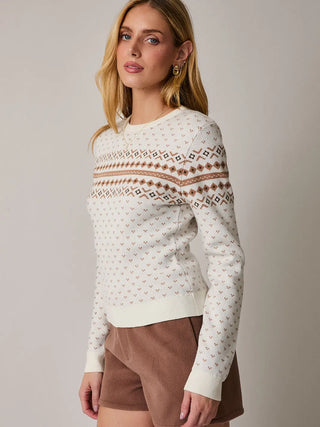 Side view of fair isle fitted sweater in cream, tan, and brown colors