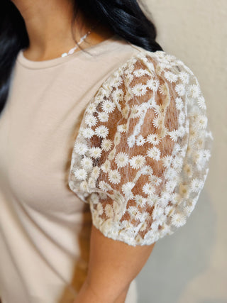 Close-up detail of floral puff short sleeve top showing sheer mesh floral sleeves