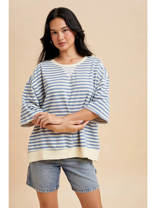 Front view of blue striped French terry short sleeve pullover top with cream trim and relaxed casual fit.
