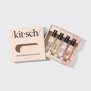 Angled view of the Kitsch Hair Perfume Discovery Set with the box open to reveal four sample hair perfume vials inside.