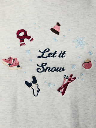 Close-Up of the embroidered Let It Snow text with red and white snowflake accents on the front of the sweatshirt.