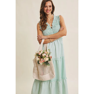 Spring midi dress with smocked top and functional pockets - full length view