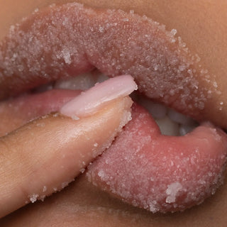 Close-up of exfoliating lip scrub texture on lips