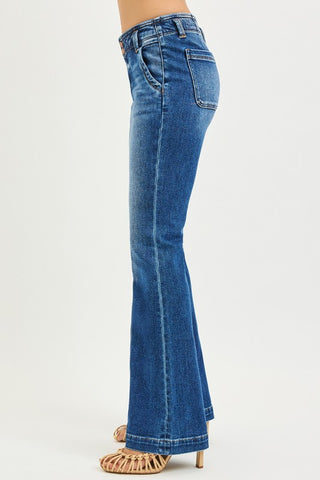 Side view of high rise flare jeans showing fitted waist, smooth hip fit, and flared leg opening.