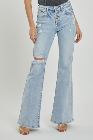 Front view of Risen Mid Rise Button Down Flare Jeans showing light wash and distressed knee