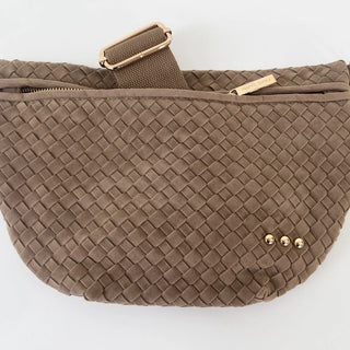 Taupe woven waist bag with gold accents on a white background