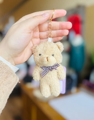 Neutral tan Teddy Bear plush keychain with gingham bow and gold keyring