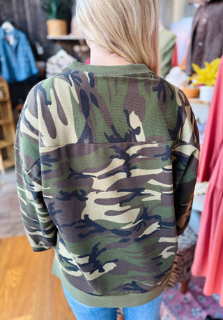 Back view of camo pullover sweatshirt showing overall camouflage pattern and relaxed fit