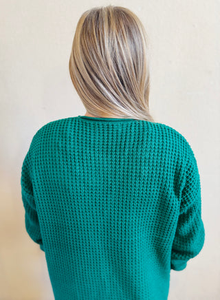 Back view of forest waffle knit cardigan highlighting soft waffle texture and longer length