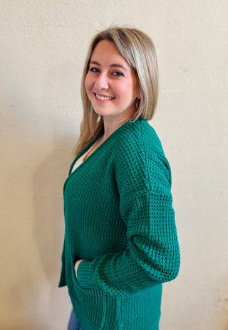 Side view of the forest waffle knit cardigan showing relaxed fit and texture throughout