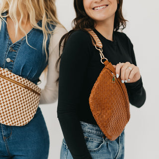Detailed close-up of the solid light mocha Westlyn woven bum bag styled crossbody with a gold zipper and woven texture.