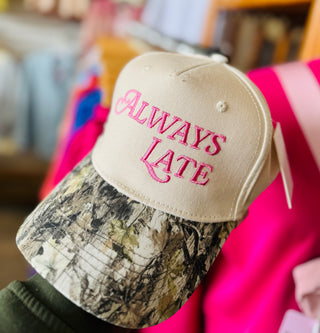 Close-up of Always Late embroidered lettering on vintage-style trucker hat with full-fabric backing