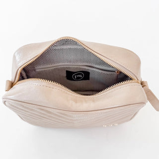 Interior of Coco camera bag showing compartment space for phone wallet and essentials