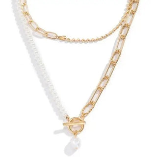 Close-up of layered pearl and chain necklace with modern toggle clasp - tarnish-free gold plated jewelry