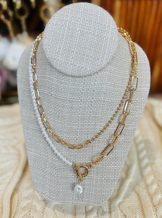 Gold plated double layer pearl necklace with toggle clasp showing two coordinated chains with lustrous pearls