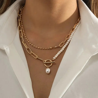 Gold plated double layer pearl necklace with toggle clasp showing two coordinated chains with lustrous pearls
