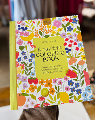 Adult coloring book page featuring detailed farmers market scene with fresh produce, baskets, and botanical illustrations
