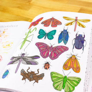 Colorful illustrations of insects on a worksheet with a wooden surface background.