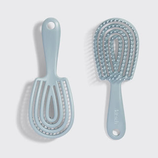 Close-up of ultra-smooth flexible bristles on Kitsch Mini Detangling Brush in Haze Blue