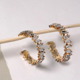 Large gold plated hoop earrings with baguette rhinestones along edge - 1.5 inch statement hoops with titanium posts