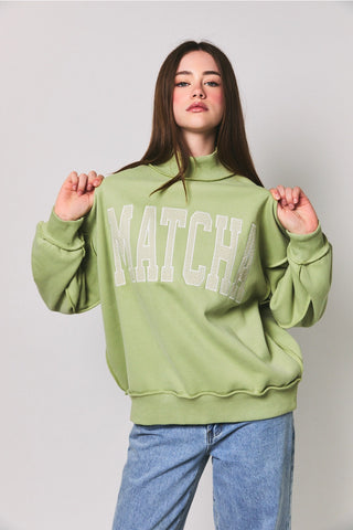 Matcha Embroidered Mock Neck Sweatshirt in light matcha green – oversized fleece-lined pullover with polka dot embroidery, front close-up view