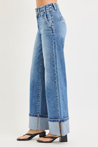 Side view of Risen high rise cuffed wide leg jeans in medium wash – showing wide leg silhouette, high rise waistband, and contrast cuffed hem