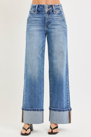 Risen high rise wide leg jeans with cuffed hem – front flat lay view showing faded medium wash denim and triple button fly