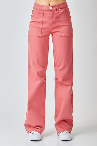 Straight on view of the Risen pair of high-waisted, wide straight-leg jeans in a brick color, featuring a front pork chop pocket detail.