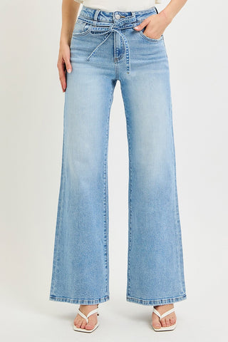 Risen high rise wide leg jeans in light wash – front view highlighting tie waist detail and relaxed wide leg silhouette