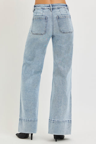 Back view of Risen mid rise ankle wide flare jeans in light wash – showing square back pockets, tummy control waistband, and wide flare ankle hem