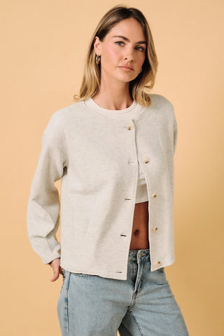 Round Neck Barrel Hem Knit Jacket in ash grey worn open over a white crop top — 5-button closure, textured knit, relaxed everyday style