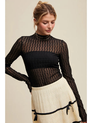 Close-up of semi sheer textured lace fabric showing delicate pattern and breathable lightweight material
