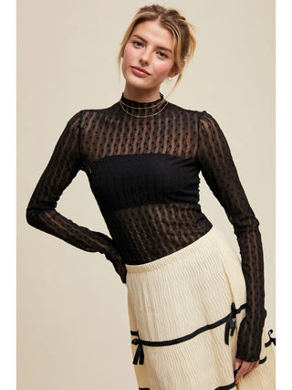 Front view of semi sheer textured lace top showing elegant pattern and fitted long sleeves - minimalist chic design